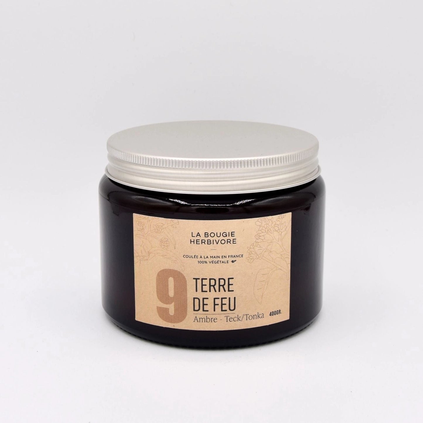 Bougie parfumée ambre teck de La Bougie Herbivore dans un pot en verre élégant