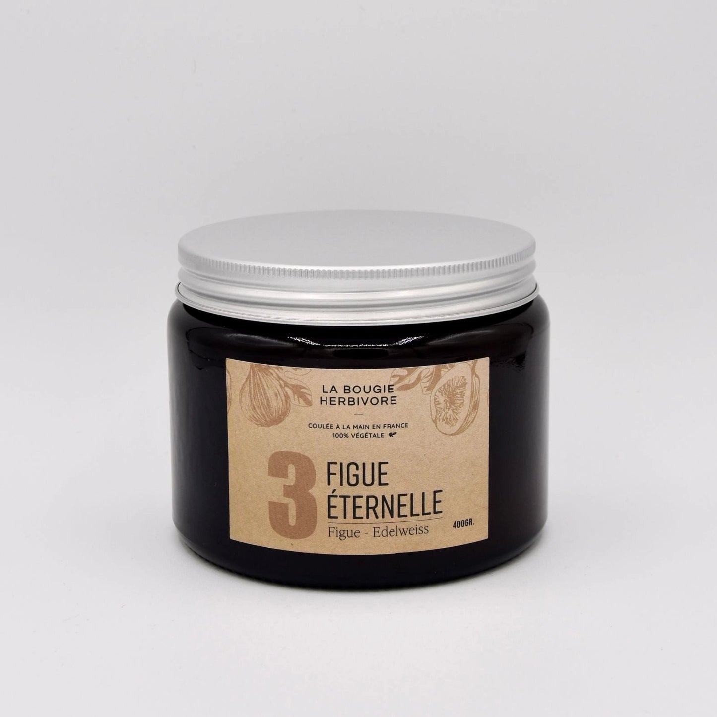 Bougie parfumée figue de La Bougie Herbivore dans un pot noir avec un couvercle argenté