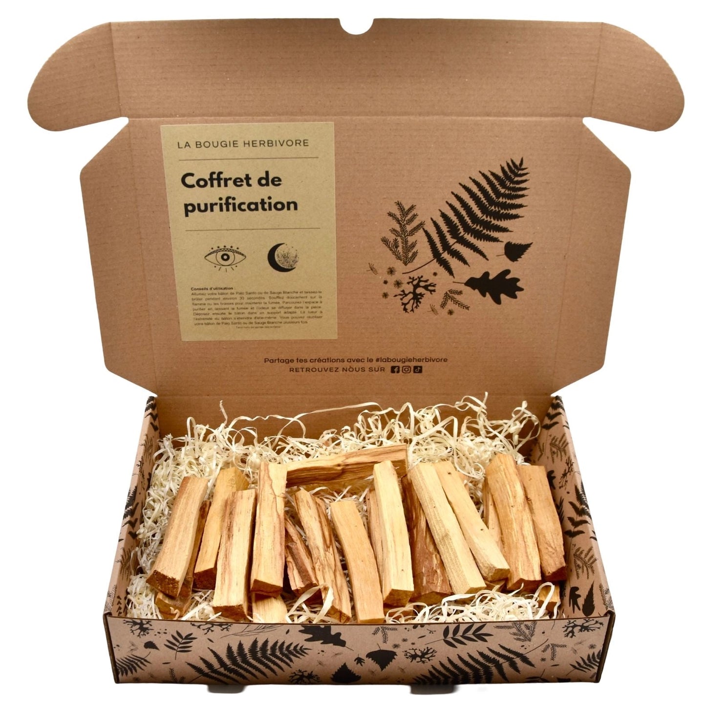 Coffret cadeau purification palo santo avec des morceaux de bois dans un emballage écologique